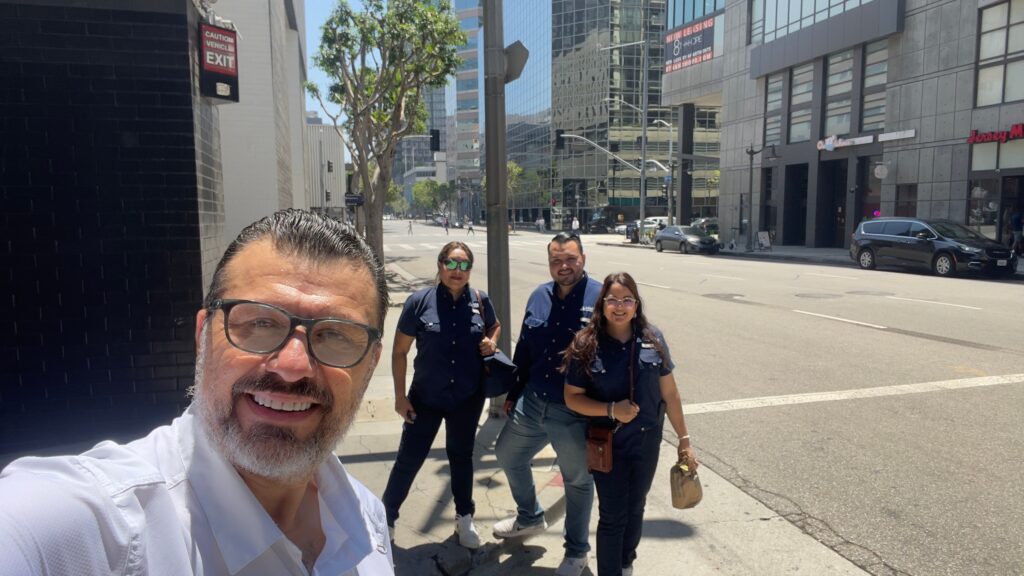 Analitika team members in company shirts on a Downtown Los Angeles street corner