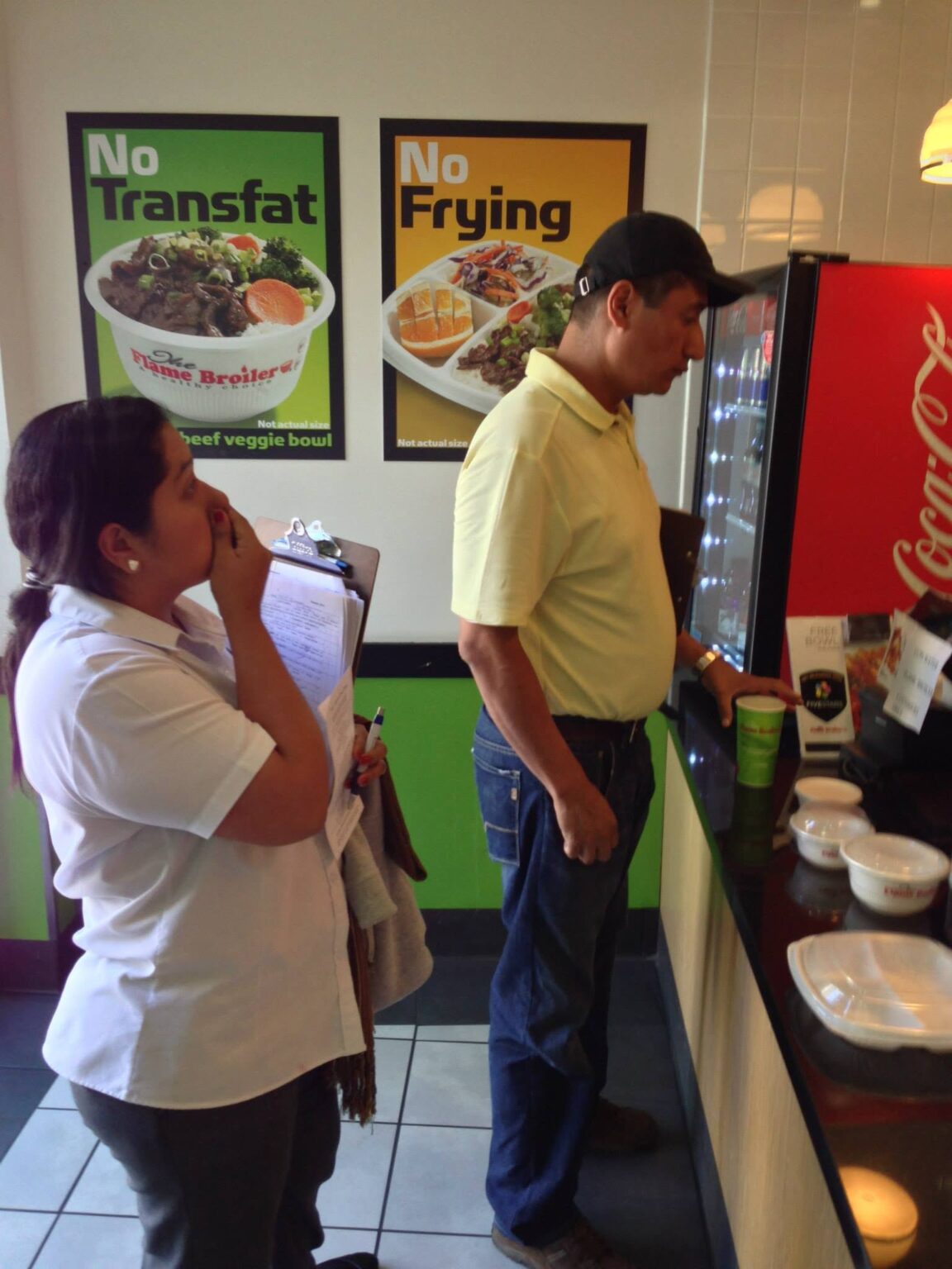 Two Analitika interviewers ordering lunch at a fast casual restaurant in Los Angeles