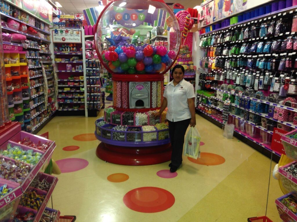 Analitika team member holding a shopping bag inside a candy store in Los Angeles